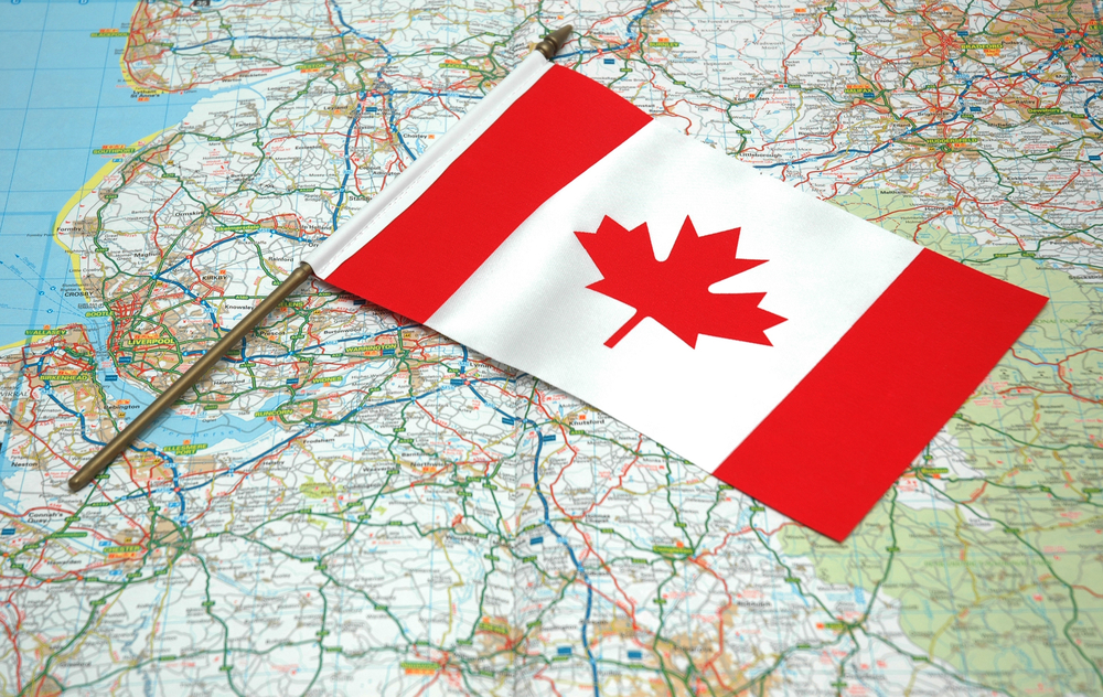 Flag of Canada over the map